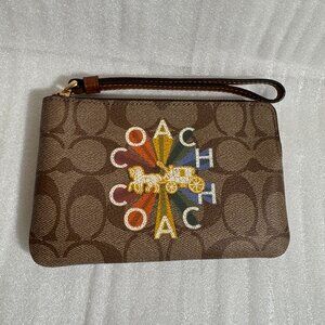 Coach Corner Zip Wristlet In Signature Canvas With Coach Radial Rainbow c7308